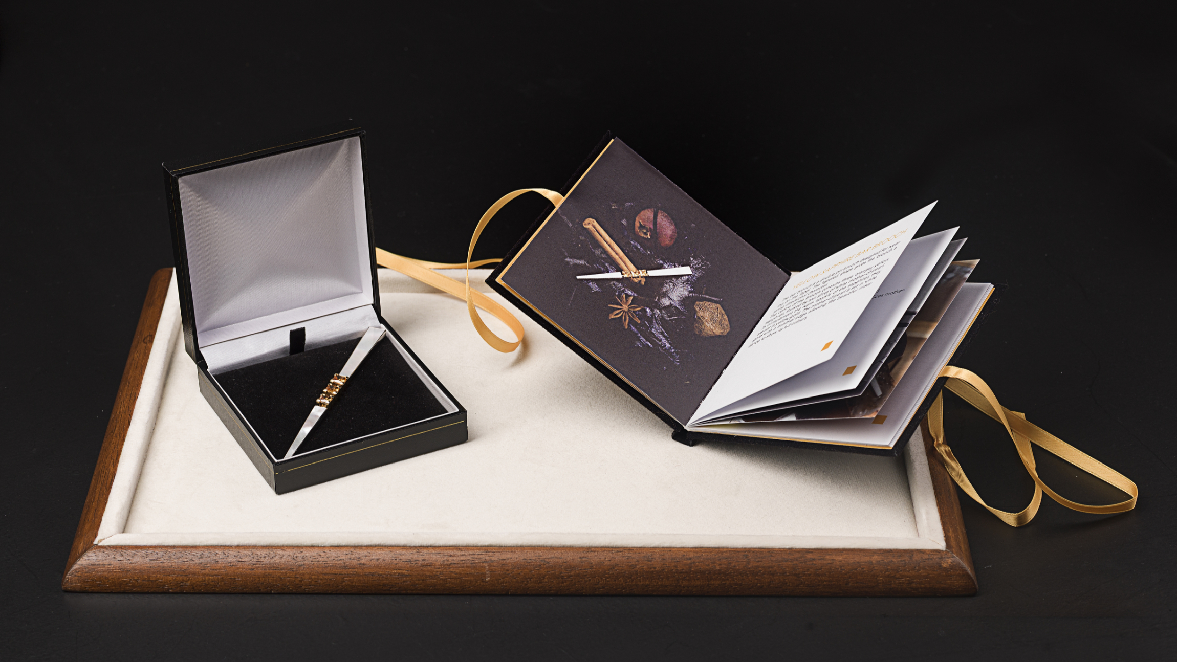 Jewel presented in a box together with booklet